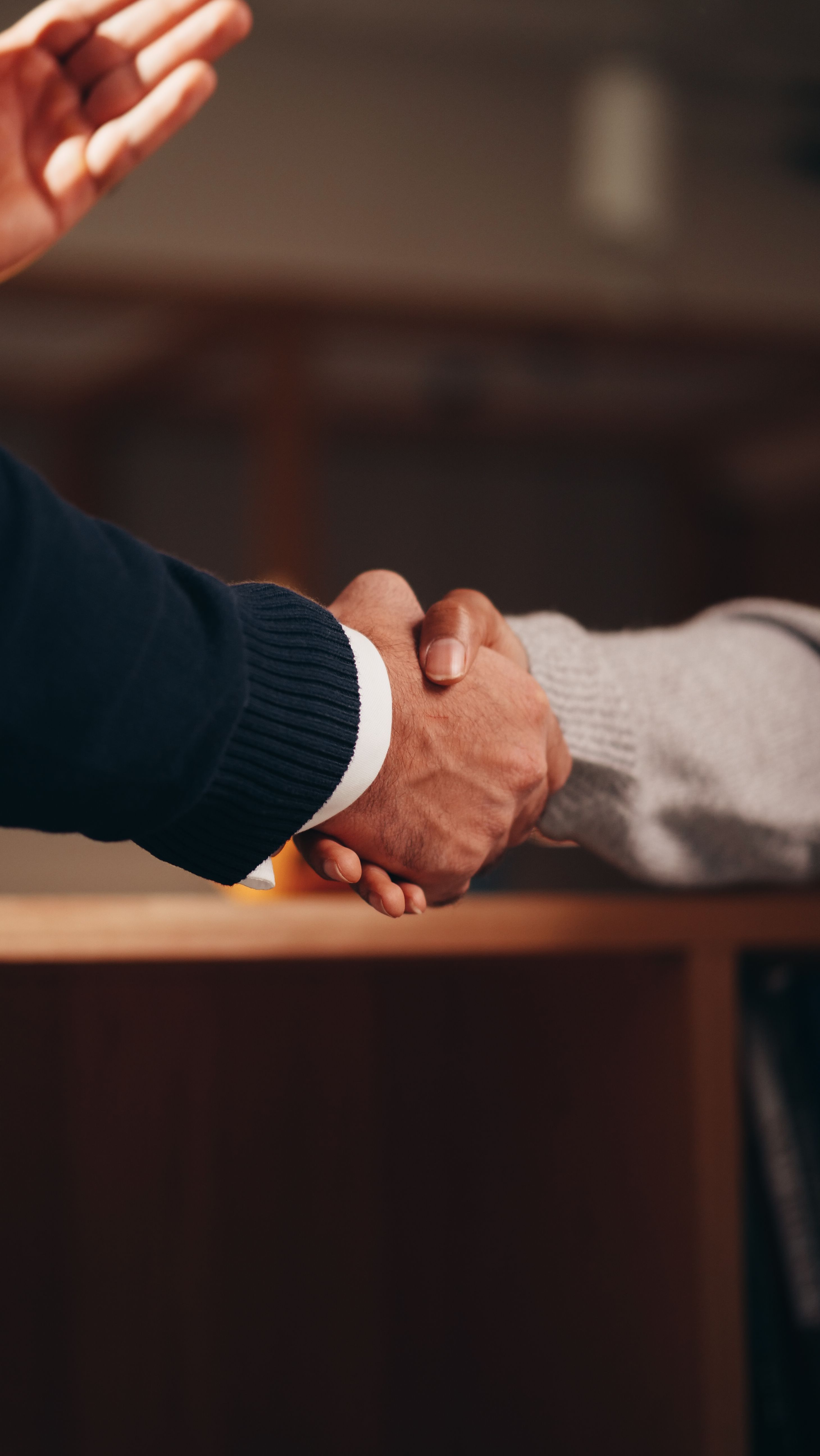 Professional handshake representing structured partnership review and agreement readiness.