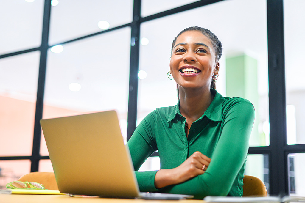 Consultant at a laptop preparing decision materials.